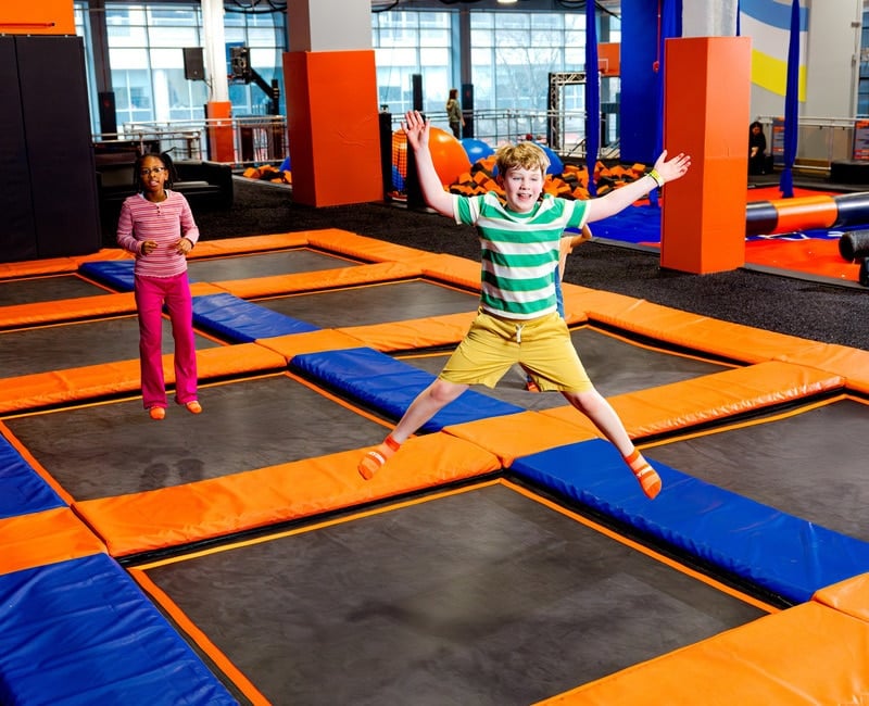 Two kids jumping at Sky Zone